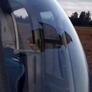 Drone penetrates helicopter windshield, injuring crew